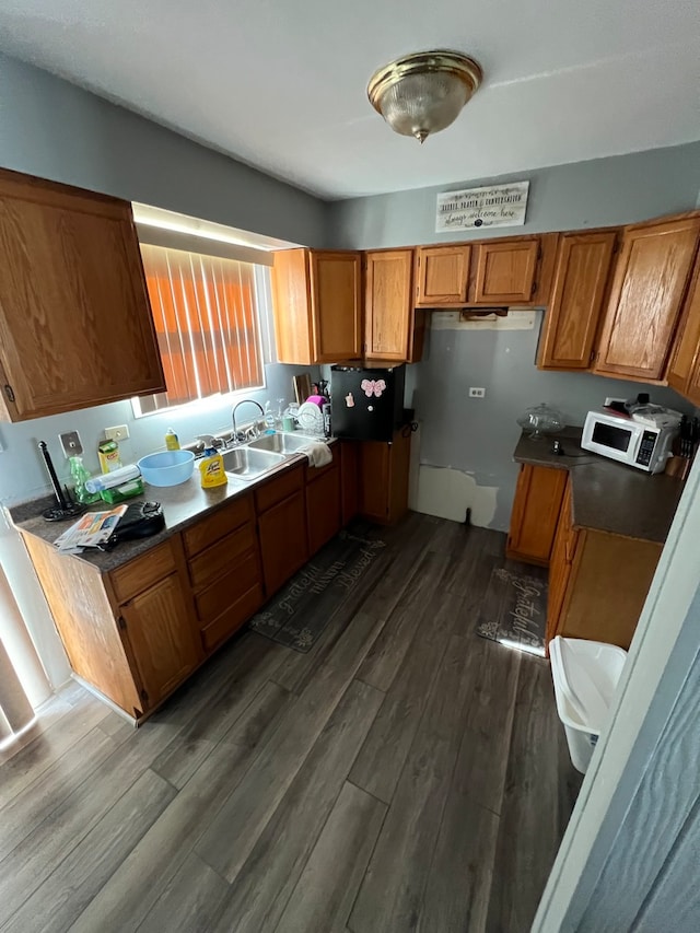 kitchen with dark wood-type flooring and sink