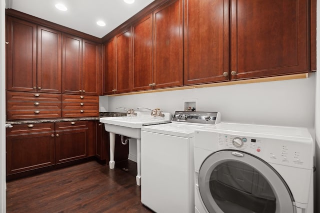 laundry area with cabinets, dark hardwood / wood-style flooring, and independent washer and dryer