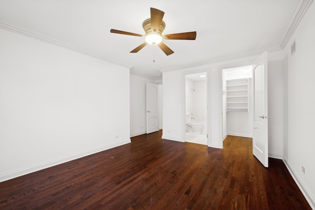 unfurnished bedroom with ceiling fan, ornamental molding, dark hardwood / wood-style floors, and ensuite bath