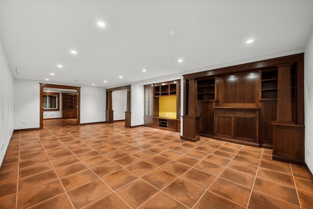 unfurnished living room featuring tile patterned flooring