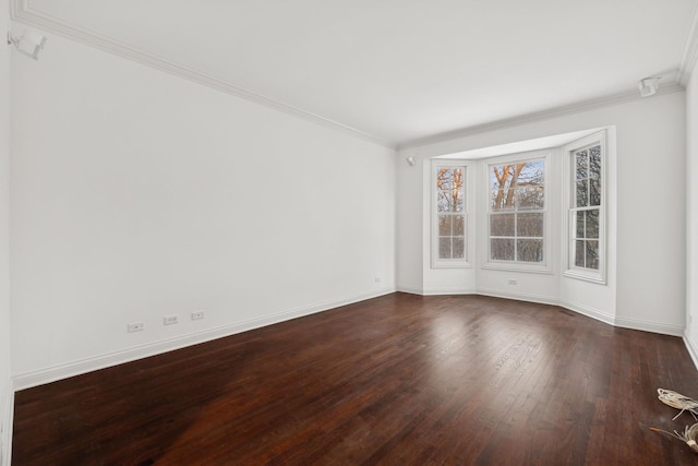 unfurnished room with dark hardwood / wood-style flooring and crown molding