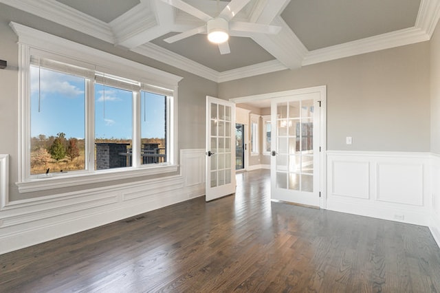 empty room featuring coffered ceiling, french doors, dark hardwood / wood-style floors, and crown molding