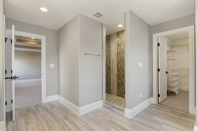 bathroom with a tile shower