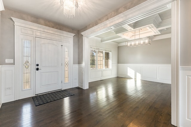 foyer entrance with beamed ceiling, coffered ceiling, dark hardwood / wood-style floors, and crown molding