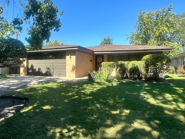 view of front facade with a front lawn and a garage