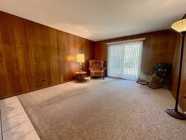 unfurnished room with tile patterned flooring and wood walls