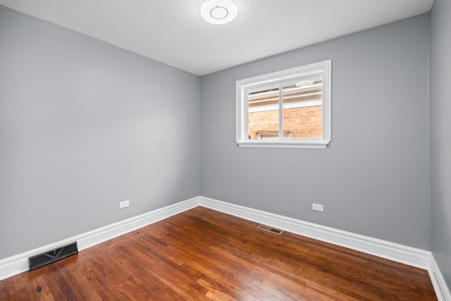 empty room featuring hardwood / wood-style flooring