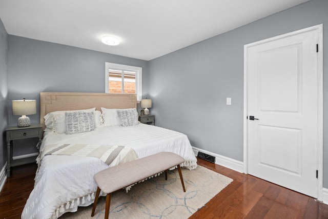 bedroom featuring dark hardwood / wood-style floors