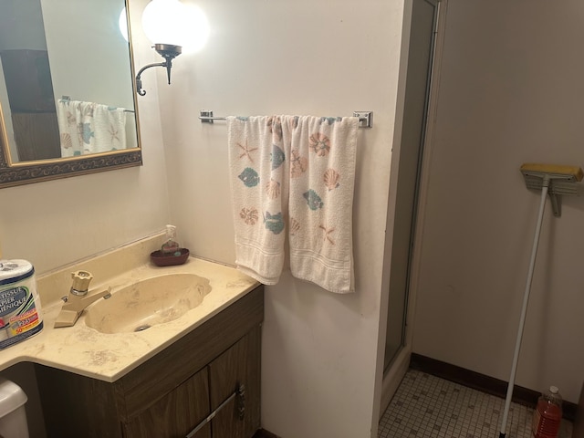 bathroom with vanity, tile patterned flooring, and a shower with shower door