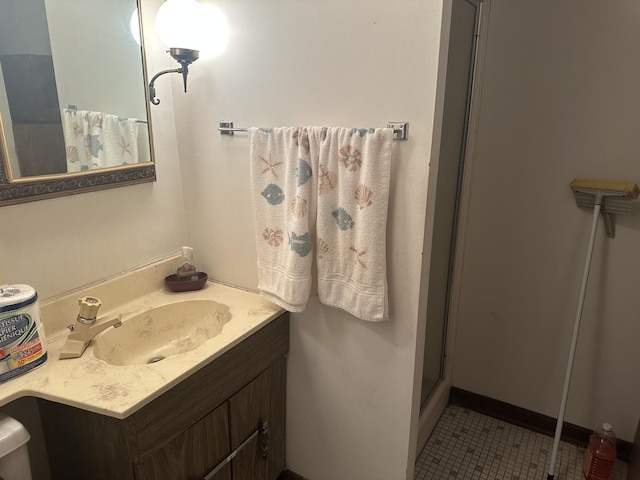 full bath featuring vanity, tile patterned flooring, and a shower