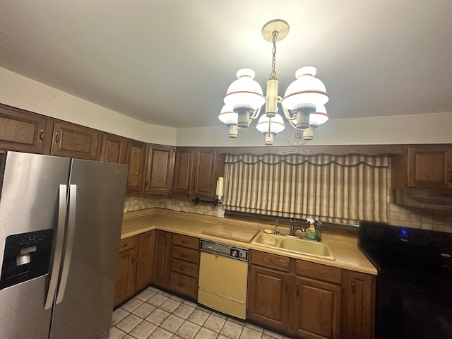 kitchen featuring tasteful backsplash, black electric range oven, white dishwasher, stainless steel refrigerator with ice dispenser, and sink