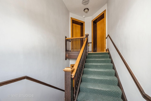 stairs with carpet flooring and baseboards