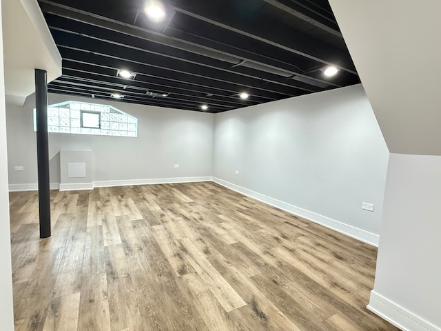 basement featuring hardwood / wood-style flooring