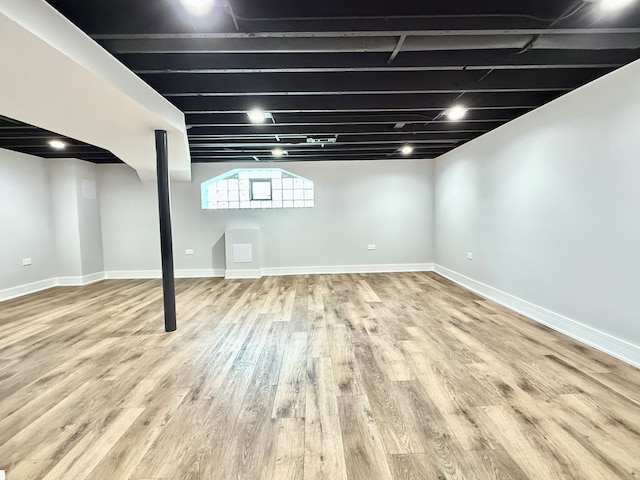 basement with wood-type flooring