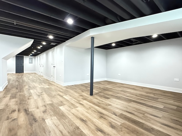 basement featuring light hardwood / wood-style flooring