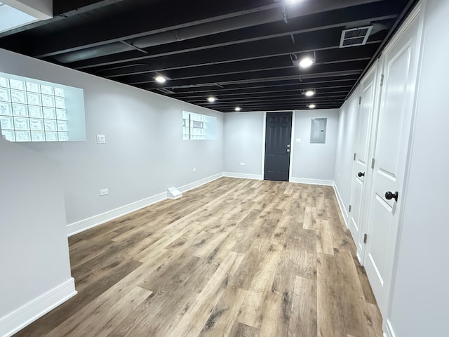 basement with wood-type flooring