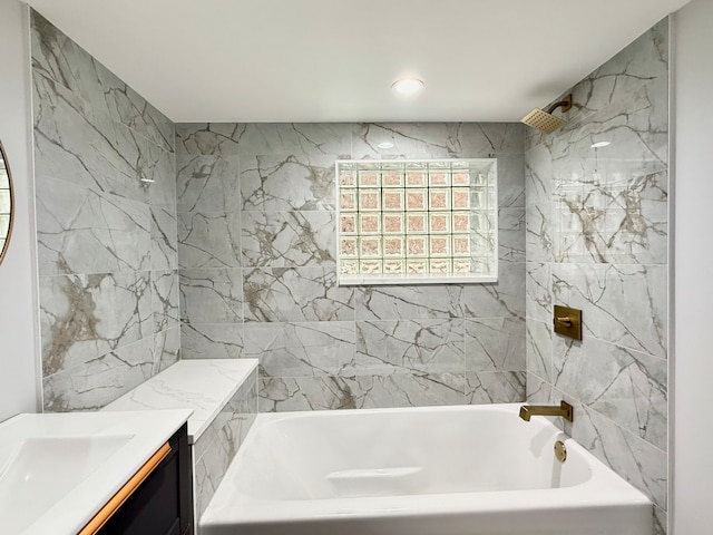 bathroom with vanity and tiled shower / bath combo