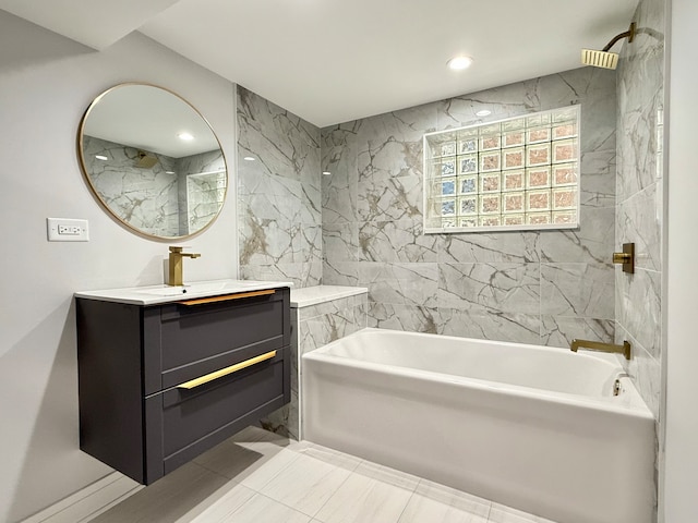 bathroom featuring vanity, tiled shower / bath combo, tile walls, and tile patterned flooring