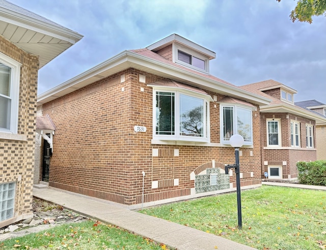 view of home's exterior featuring a yard