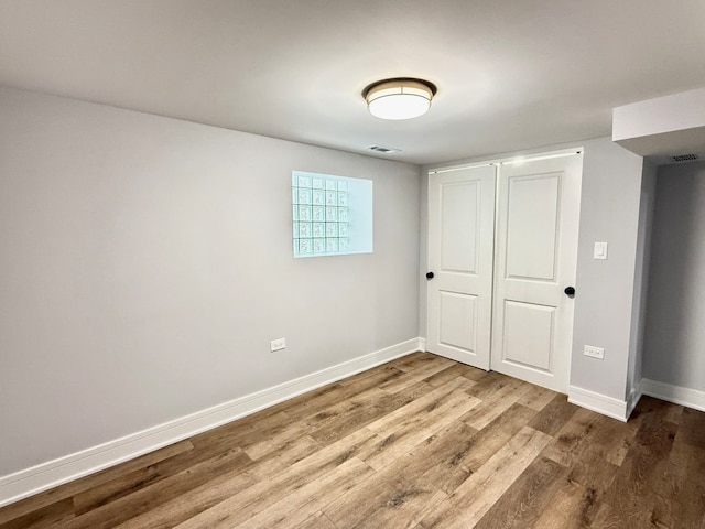 empty room with hardwood / wood-style floors