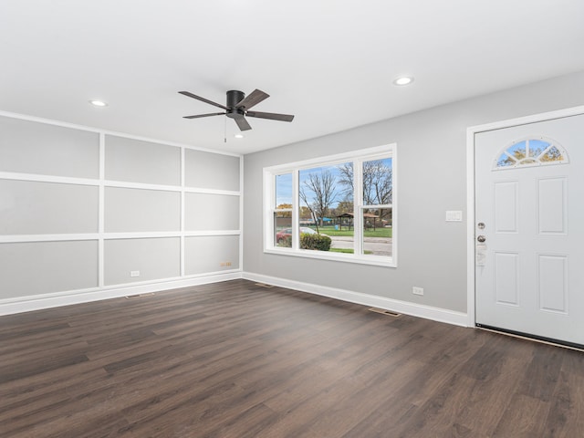 entryway with dark hardwood / wood-style flooring and ceiling fan