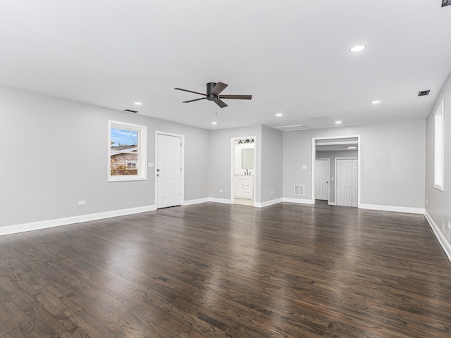 unfurnished living room with ceiling fan and dark hardwood / wood-style floors