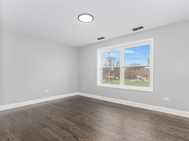 empty room featuring dark wood-type flooring