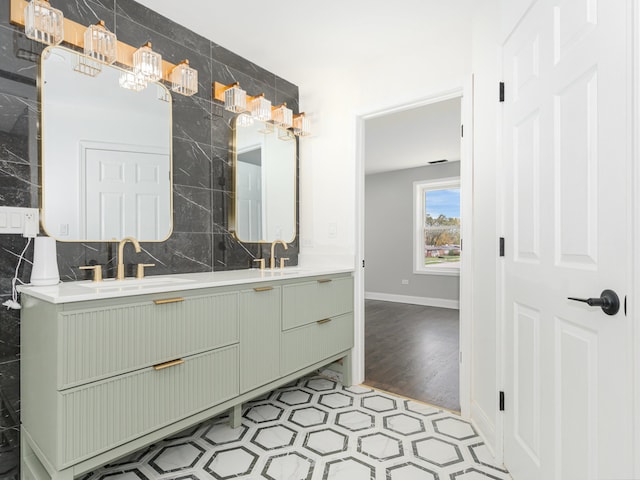 bathroom with decorative backsplash, wood-type flooring, and vanity