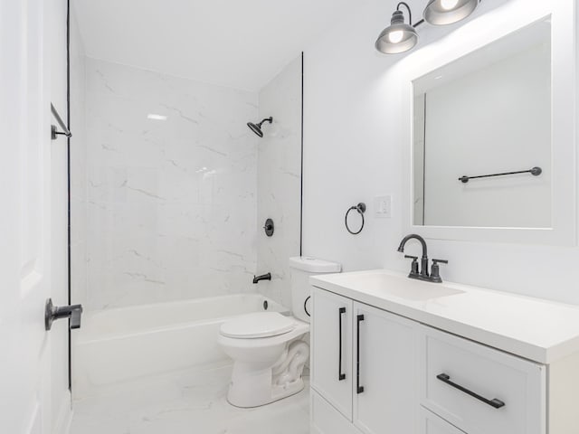 full bathroom featuring tiled shower / bath, toilet, and vanity