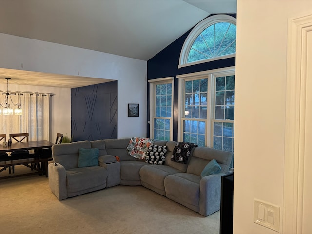 carpeted living room with lofted ceiling and a notable chandelier