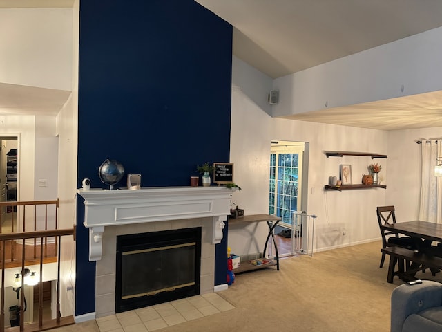 carpeted living room with a fireplace