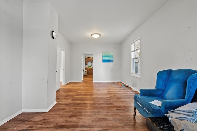 living area with hardwood / wood-style flooring