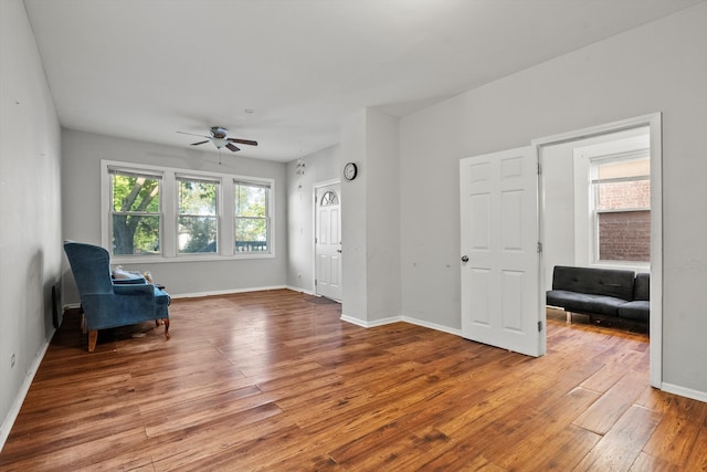 unfurnished room with wood-type flooring and ceiling fan