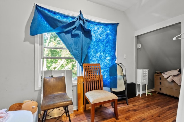 sitting room with vaulted ceiling and dark hardwood / wood-style floors