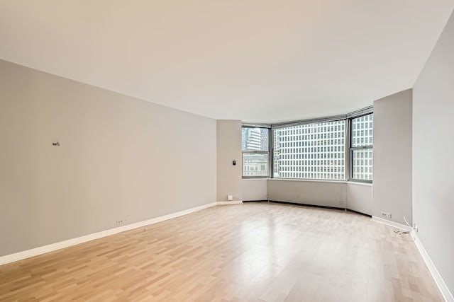 unfurnished room featuring light hardwood / wood-style flooring