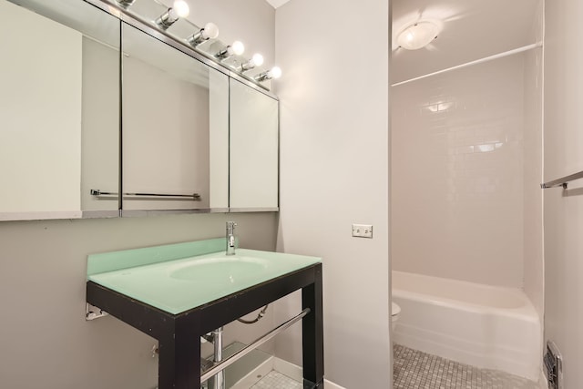 full bathroom with tub / shower combination, tile patterned floors, sink, and toilet