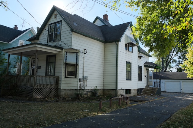 view of front of property featuring an outbuilding and a garage