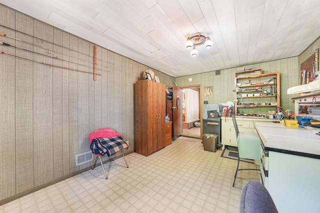 office area featuring wood walls, a workshop area, and wooden ceiling