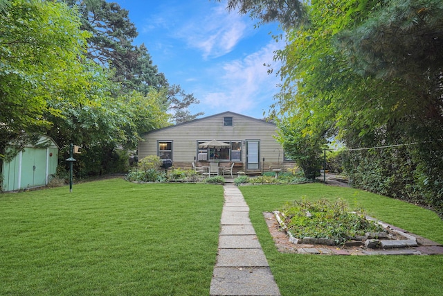 rear view of house with a patio and a yard