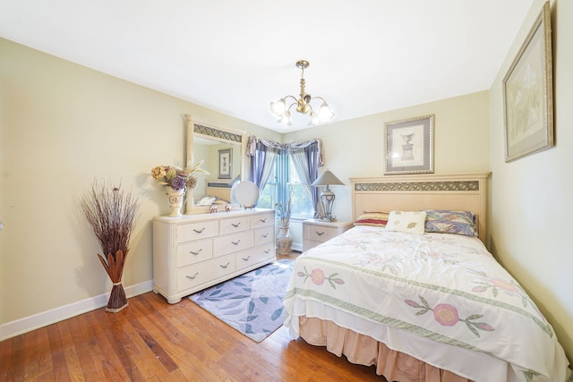 bedroom with vaulted ceiling and light hardwood / wood-style floors