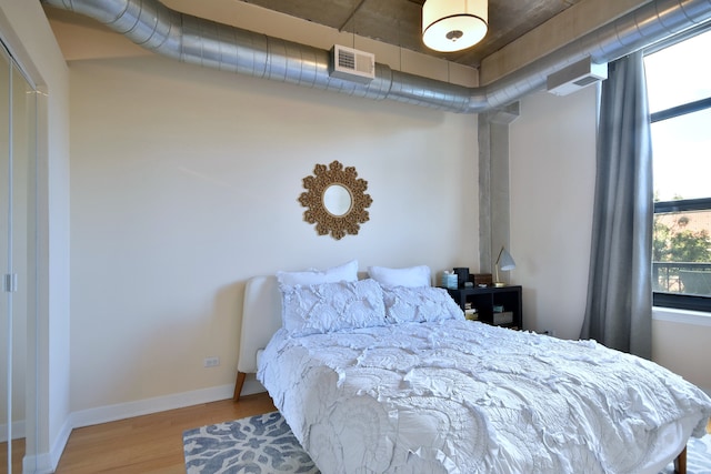 bedroom with light hardwood / wood-style flooring