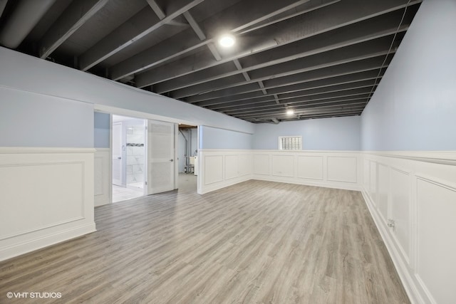 basement featuring light wood-type flooring