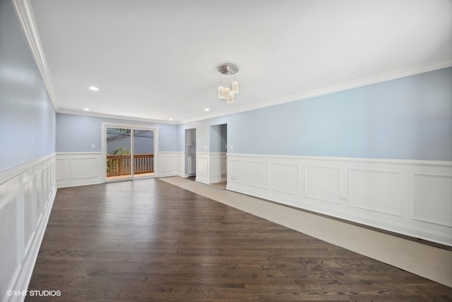 unfurnished room featuring dark wood-type flooring and crown molding