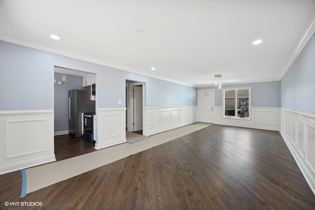 unfurnished living room with dark hardwood / wood-style flooring and crown molding