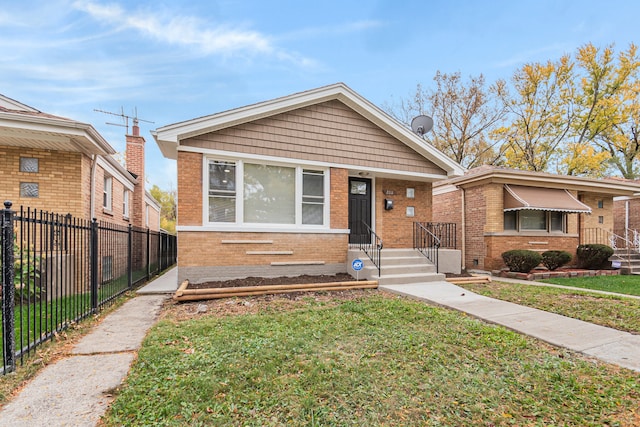 bungalow-style home featuring a front yard