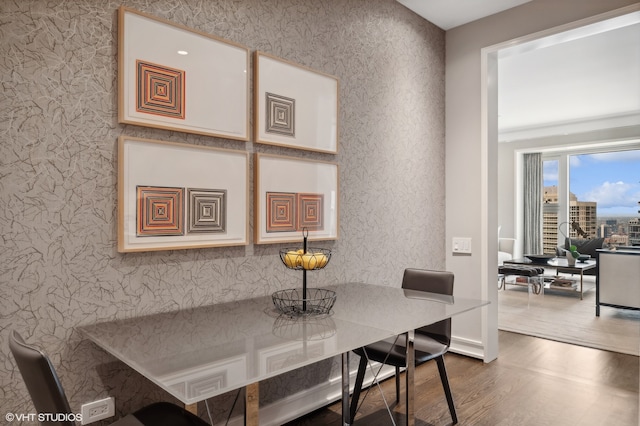 dining area with dark hardwood / wood-style floors