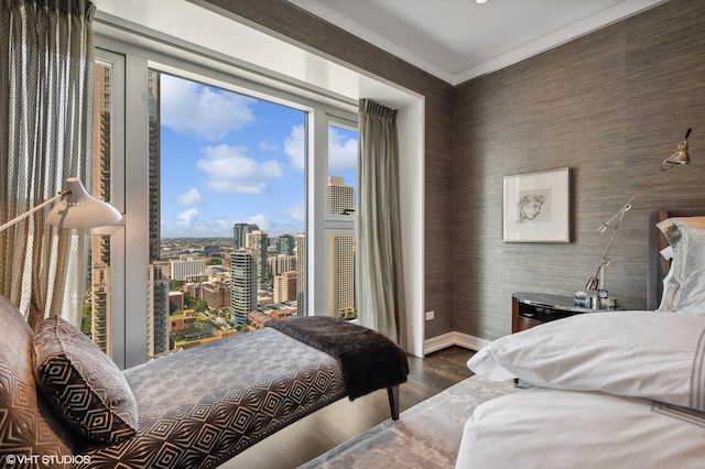 bedroom featuring dark hardwood / wood-style floors and crown molding