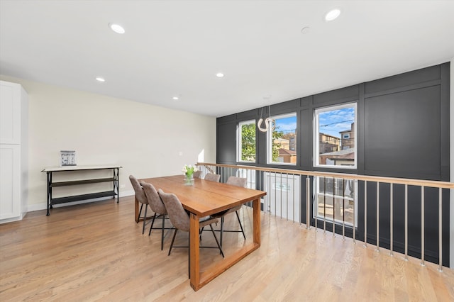 dining space with light hardwood / wood-style floors