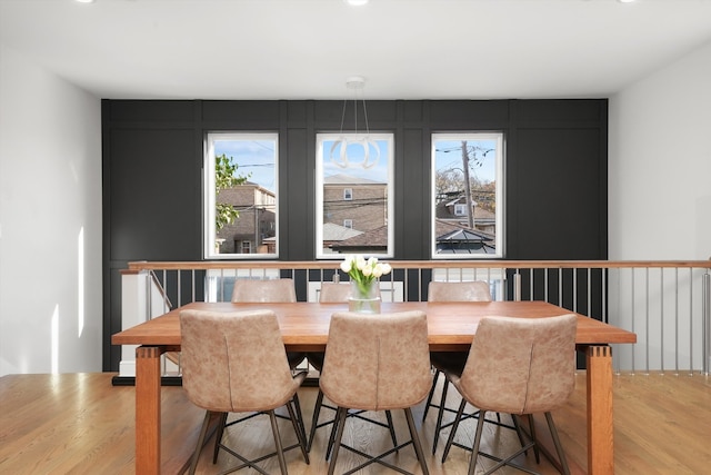 dining room featuring light hardwood / wood-style flooring and a healthy amount of sunlight