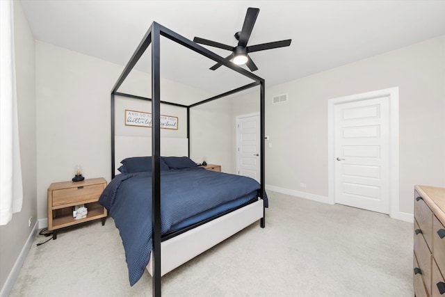 bedroom with ceiling fan and light colored carpet